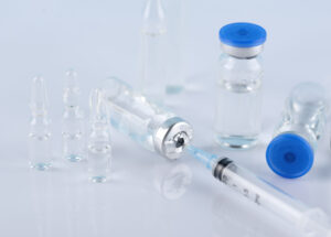 vials-syringes-arrangement-high-angle
